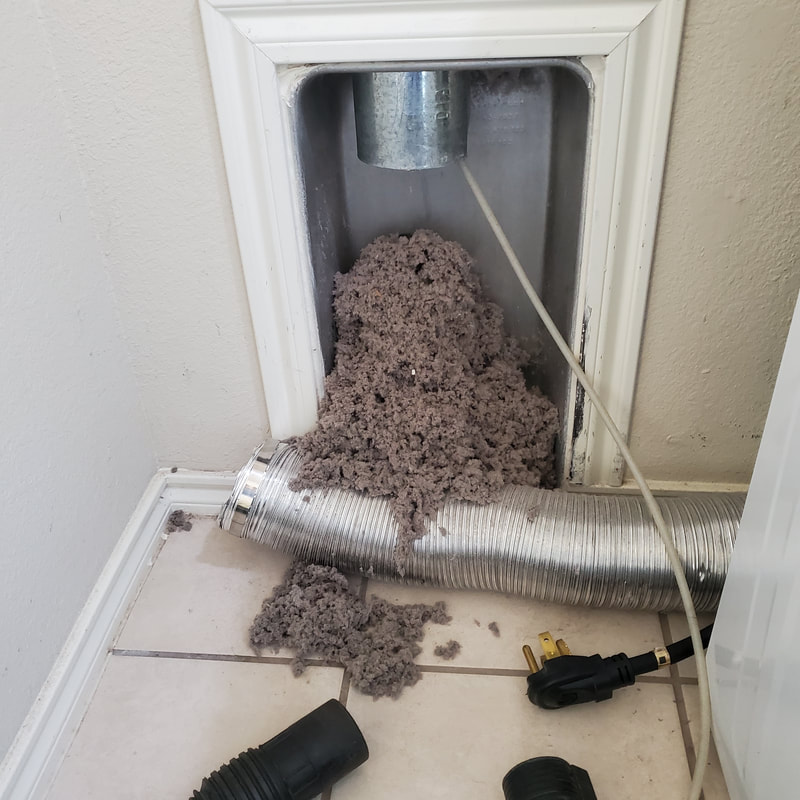 home dryer unit being cleaned